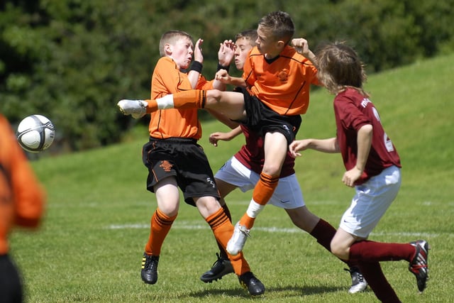 A tussle for the ball during the Foyle Cup match between the Institute and St. Kevin's Boys under-12 sides at Strathfoyle. LS30-192KM10