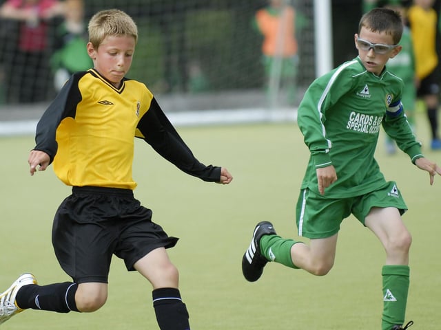 Limavady United under-10's player Sam McClelland tries a shot at goal during their Foyle Cup match against Shankill Youth. LS30-196KM10