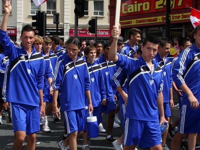 ANB Soccer team from Canada, wave to the crowd gathered in the city centre. LS2910-575MT.
