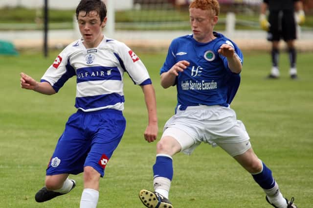 Ryan O'Reilly (NECSL) and Shane McGinty (QPR) in action during the U16 Cup Final, at the Foyle Cup 2010. 2407GM16