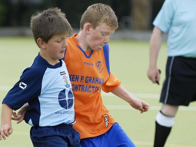 Institute under-10's player Dylan Lynch battles for the ball during their Foyle Cup match against Mulroy Academy. LS30-188KM10