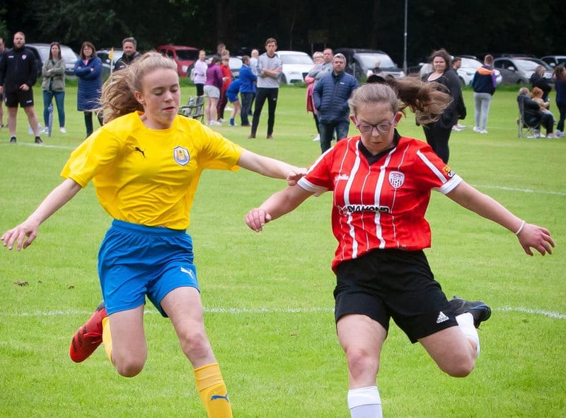 Derry City's Laura Downey manages to get in this cross despite the close attention of her Roe Valley marker in the U16 Ladies Foyle Cup group match at Prehen.