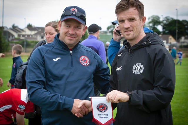 Clooney Football Club make a gesture of friendship to Foyle Harps.