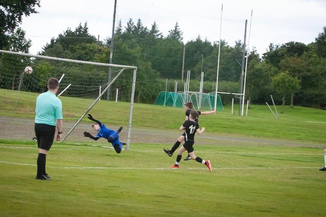 Don Bosco's goalkeeper Murphy fails to keep out the rebounded penalty against Letterkenny Rovers in the u-12 Foyle Cup clash at Thornhill, Derry.