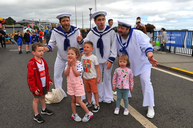 Jamie, Emilie, Harrison and Erin pictured with the singing sailors at the Foyle Maritime Festival. Photo: George Sweeney. DER2229GS – 056