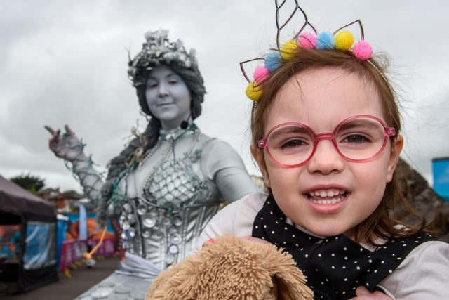 Holly aged 5 is pictured enjoying the sunshine and festivities at the Foyle Maritime Festival on the River Foyle. The festival runs until Sunday, July 24, withactivities including workshops, funfair attractions and boat tours