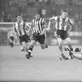 Newcastle United’s Belgian international Philippe Albert attempts to dispossess Derry City striker Liam Coyle                                                                 during their clash in the Irish International Club final at Lansdowne Road as Rob Lee (Newcastle) and Gary Beckett (Derry City) look on.