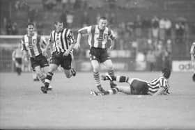 Newcastle United’s Belgian international Philippe Albert attempts to dispossess Derry City striker Liam Coyle                                                                 during their clash in the Irish International Club final at Lansdowne Road as Rob Lee (Newcastle) and Gary Beckett (Derry City) look on.