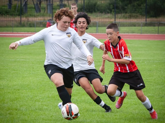 Beach FC's Brogan Comer gets possession during Thursday's u-14 Foyle Cup final group match against Derry City.