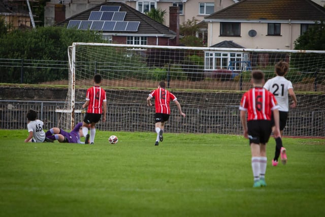 Beach FC's Bryant Waits pulls a goal back after a mistake in the Derry defence.