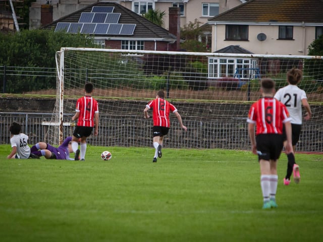 Beach FC's Bryant Waits pulls a goal back after a mistake in the Derry defence.
