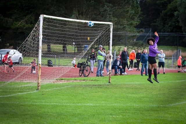 SION GOAL!. . . .Derry netminder Caodain Long can only watch as Sion's Bernie Ferreira's lob makes its way into the nets during Thursday night's u-16 Girls Foyle Cup final at Swilly Stadium, Derry.