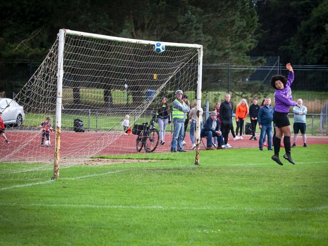 SION GOAL!. . . .Derry netminder Caodain Long can only watch as Sion's Bernie Ferreira's lob makes its way into the nets during Thursday night's u-16 Girls Foyle Cup final at Swilly Stadium, Derry.