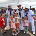 Jamie, Emilie, Harrison and Erin pictured with the singing sailors at the Foyle Maritime Festival. Photo: George Sweeney. DER2229GS – 056