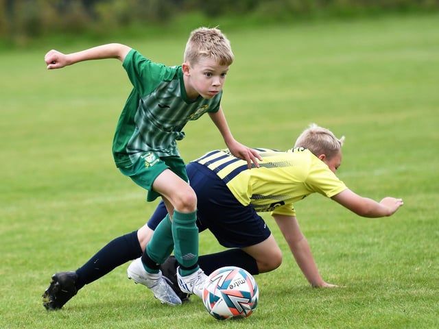 Darragh McKenna powers through on goal for Bonagee United under-10's during their match against Sion Swifts Colts.
