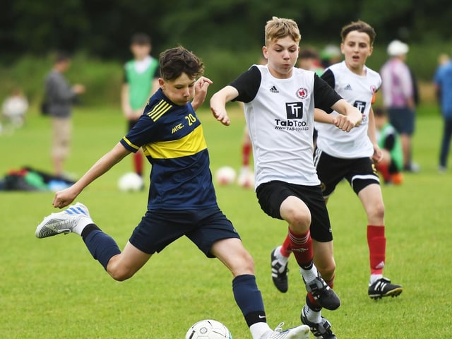 Don Boscos under-14's forward Cal Tabb lines up a shot at goal during their match against Hillsborough Boys.