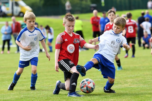 Conor McDermott, Maiden City Colts, and Keelan Gallagher, Quigley's Point Swifts under-9's tussle for the ball.