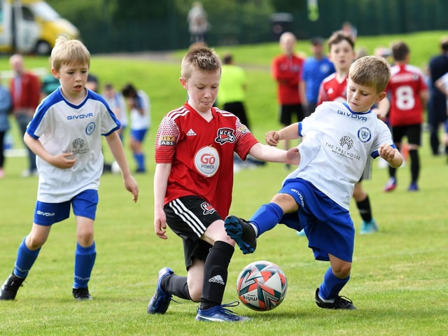 Conor McDermott, Maiden City Colts, and Keelan Gallagher, Quigley's Point Swifts under-9's tussle for the ball.