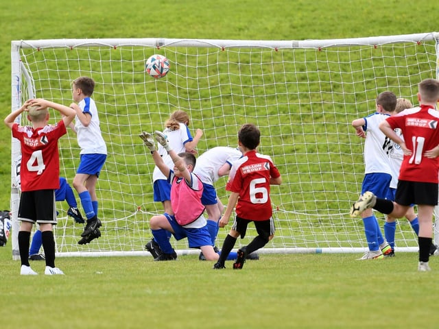 Corey Mullan scores with this free kick for Maiden City Colts under-9's during their match against Quigley's Point Swifts.