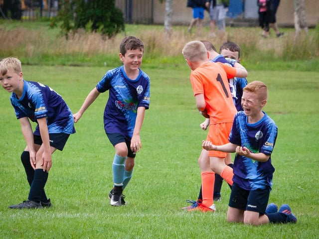 Action from the Magherafelt Sky Blues v. Ballinamallard u-9 clash at Templemore on Thursday when a late equaliser was celebrated by the Sky Blues.