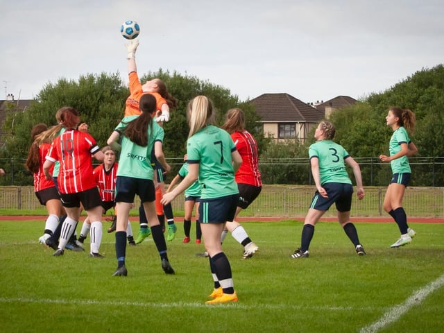 The Sion Swifts keeper gets a hand to this ball