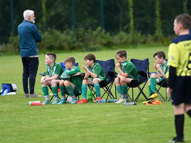 The Bonagee United subs watch their match against Sion Swifts Colts under-10's in comfort.