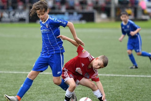 Coleraine player Conor Wilson battles with Maiden City Academy's Ronan Gray during the O'Neill's Foyle Cup under-12's final on Saturday. Picture by Keith Moore