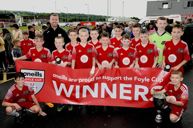 John Murphy from O'Neill's pictured with the Maiden City Academy team which lifted the O'Neill's Foyle Cup Under-12's Cup at the Brandywell on Saturday. Picture by Keith Moore