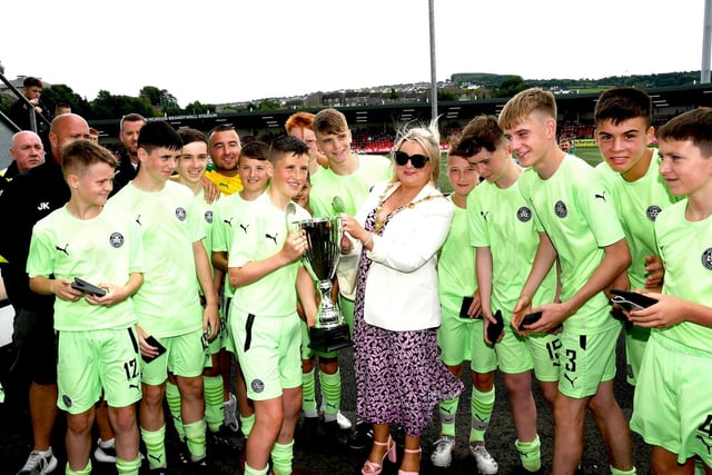 The Mayor, Councillor Sandra Duffy presenting the O'Neill's Foyle Cup Under-14's Cup to Cliftonville captain Ben Macmanus at the Brandywell on Saturday. Picture by Keith Moore