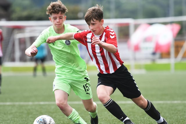 Tristar under-14's player Ben Richards powers past Cliftonville's Conaire Smyth, during Saturday's final, at the Brandywell. Picture by Keith Moore
