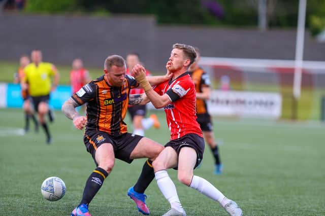 Dundalk's Mark Connolly stops Jamie McGonigle in his tracks during a recent match at Brandywell.