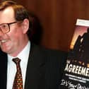 PACEMAKER BELFAST 18/04/98 Ulster Unionist Party leader David Trimble pictured with his copy of the Agreement at a press conference in the Europa Hotel in Belfast where he won the big vote by his party on weather to endorse the Mitchell Agreement or not.