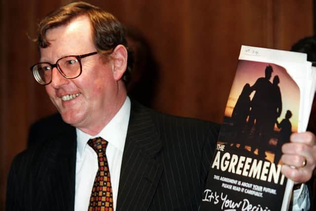 PACEMAKER BELFAST 18/04/98 Ulster Unionist Party leader David Trimble pictured with his copy of the Agreement at a press conference in the Europa Hotel in Belfast where he won the big vote by his party on weather to endorse the Mitchell Agreement or not.
