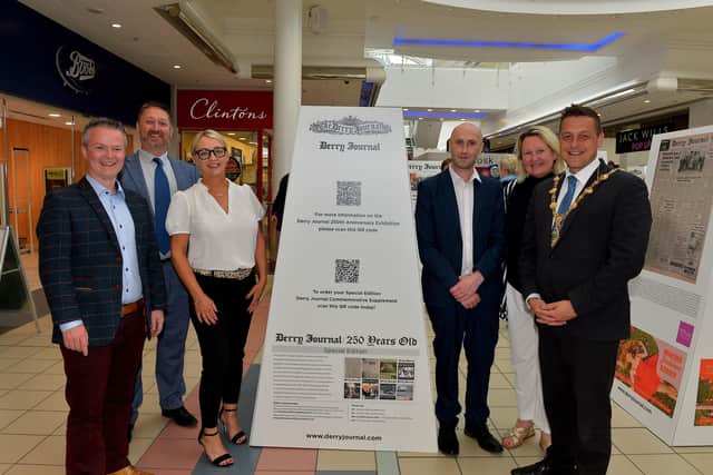 May 2022: The touring exhibition was launched at Foyleside Shopping Centre and has  subsequently been displayed in Northside Shopping Centre. Pictured at the launch are Professor Malachi O’Neill, Ulster University, Steve Frazer, manager, City of Derry Airport, Jacqui Diamond, Derry Journal, Andrena O’Prey, National World Ltd, Derry Journal editor Brendan McDaid and then Mayor Graham Warke. Photograph: George Sweeney. DER2223GS – 074