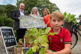 Paul Sweeney, National Lottery Community Fund Chair with Sahuna Kelpie, Shauna Kelpie, Fund Officer from Acorn Farm Project and Aine Kivlehan and her son John pictured on the sight of the Acorn Farm Project at Browning Drive.