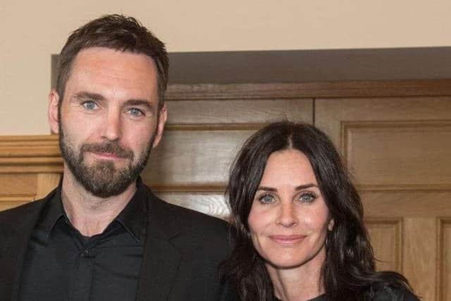 Johnny McDaid and his fiancee Courtney Cox.