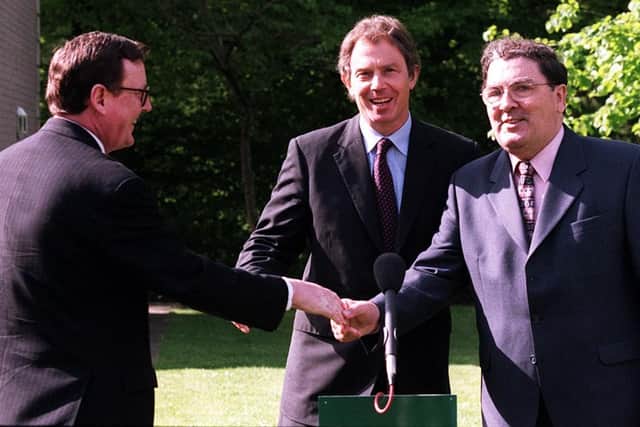 PACEMAKER BELFAST 21/05/98 Prime Minister Tony Blair chats to Ulster Unionist leader David Trimble and SDLP leader John Hume after a working breakfast at the Dunadry hotel on the outskirts of Belfast this morning as the trio prepared for a final push for a YES vote in tomorrow's referendum.