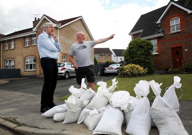 Infrastructure Minister John O’Dowd meeting a resident in Ivy Mead.