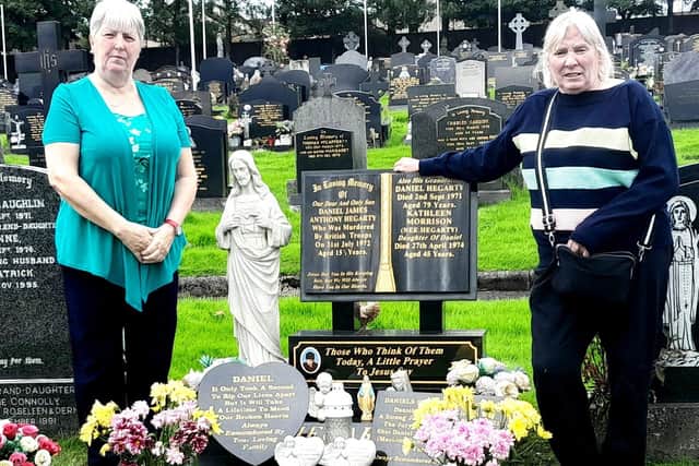 Margaret Brady and Kathleen Devenney, sisters of Daniel Hegarty, pictured at his graveside this week.