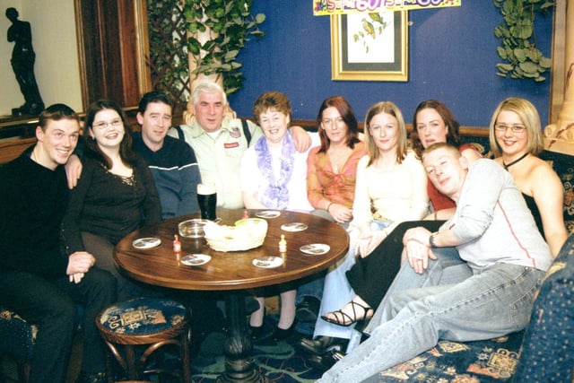 September 2002... Angela Cox celebrates her 60th borthday with husband, Jim, and members of her family circle.