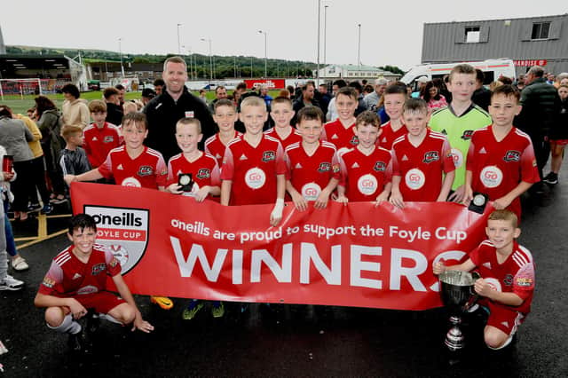 John Murphy from O'Neill's pictured with the Maiden City Academy team which lifted the O'Neill's Foyle Cup Under-12's trophy at the Brandywell on Saturday. Picture by Keith Moore