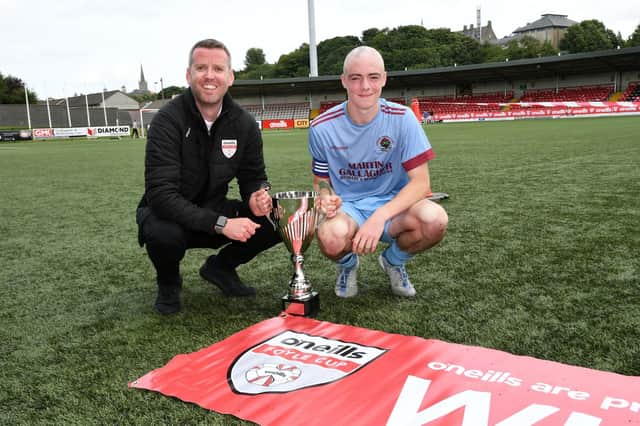 John Murphy from O'Neill's presenting the O'Neill's Foyle Cup Under-16's Cup to Institute captain Oisin Devlin at the Brandywell on Saturday. Picture by Keith Moore