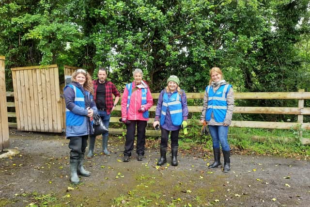 Trish Murphy from IWT along with other ECO Carn volunteers at a previous balsalm bashing event along the Donagh River.