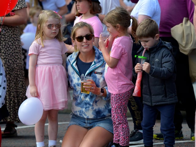 A family enjoying the atmosphere at the Clonmany Festival Parade held on Sunday afternoon last. Photo: George Sweeney.  DER2231GS – 022