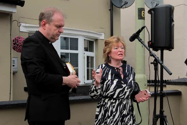 Rosemary Doherty addressing Sunday's event at Creggan Heights in memory of Daniel Hegarty. On left is Rev. Joe Gormley, PP of St Mary's Church, Creggan. DER2231GS – 030