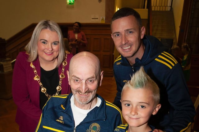 Don Boscos U8 captain Liam McCallion pictured alongside Don Boscos stalwart Brian Kelly at Monday evening's reception in the Guildhall. Included at back are Mayor, Sandra Duffy and manager Shane McCallion. Picture by Jim McCafferty Photography