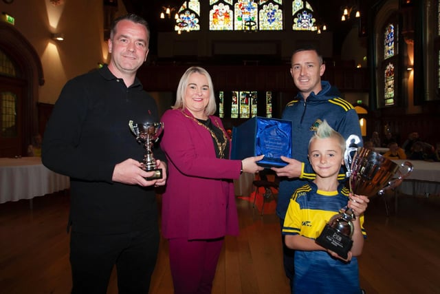 The Mayor, Sandra Duffy making a special presentation to Don Bosco's U8's manager Shane McCallion in recognition of their recent success in the Foyle Cup and the FonaCAB Youth Cup 2022 at a Mayoral Reception at the Guildhall on Monday evening last. Included are Johnny Wright, coach and Liam McCallion, club captain. Picture by Jim McCafferty Photography