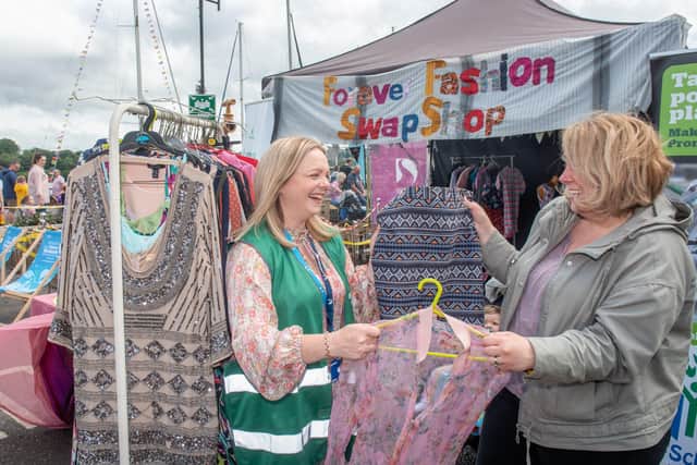 Catherine Doherty and Dori Allen exchange some clothing at the festival's Forever Fashion Swap Shop. Picture by Martin McKeown.