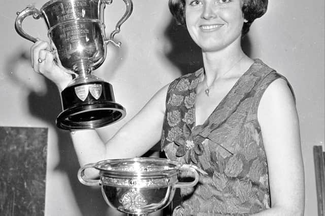 1966... Maureen Hegarty with two of the many trophies she won at Feis Doire Colmcille.