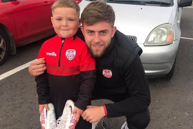 Braelin meets his hero Will Patching after last Saturday's match when the City star gave him a pair of signed boots.